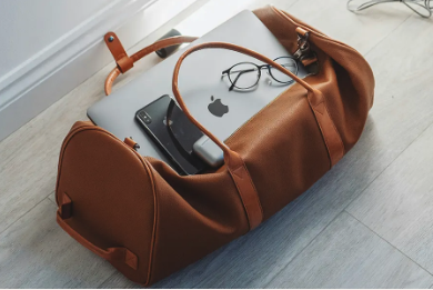brown leather bag on the floor